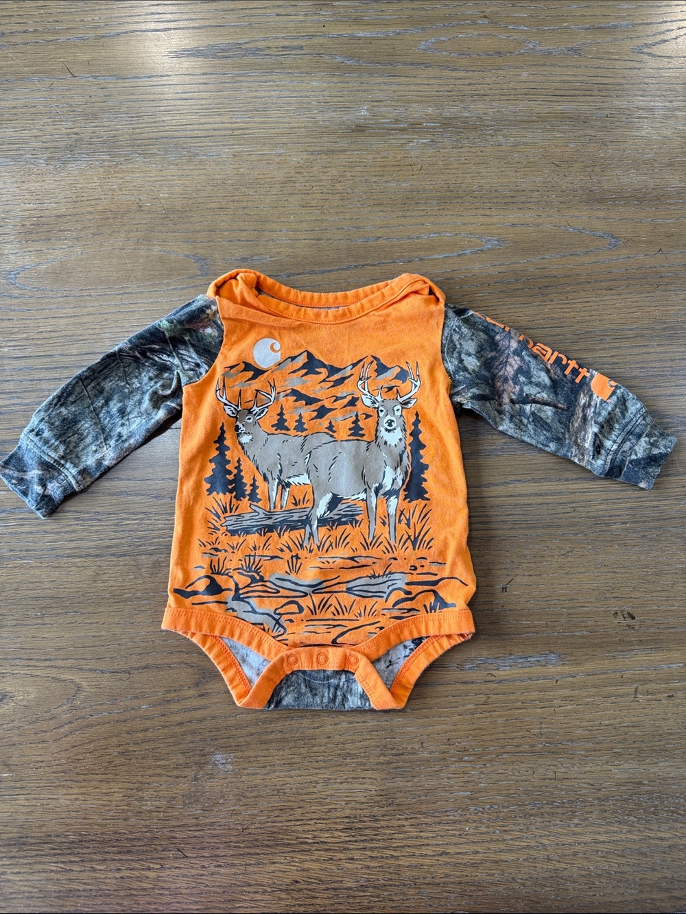 Carhartt Orange One-Piece with Camo Sleeves and Deer Print